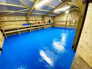 Ford Tractor Blue two pack epoxy floor paint top coat applied to a garage floor