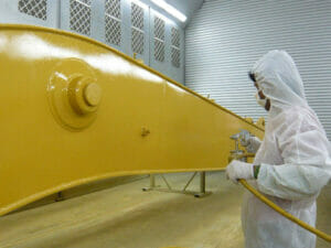 One Coat High Build Steel Enamel being sprayed onto metal