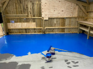 Ford Tractor Blue two pack epoxy floor paint top coat applied to a garage floor