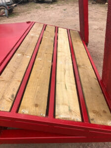 Trailer painted in post office red agricultural oxide paint (detail)