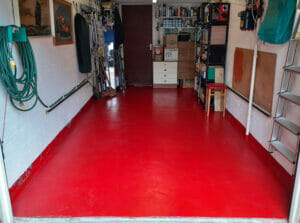 Post Office Red Quick Dry High Build Floor Paint applied to a garage floor