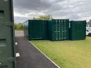 Painted skips with Brunswick Green container paint