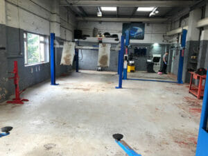 Ford Tractor Blue two pack epoxy floor paint top coat applied to a garage floor
