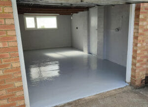 Two pack epoxy epoxy floor paint top coat applied to a garage floor