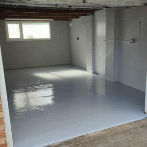 Two pack epoxy epoxy floor paint top coat applied to a garage floor